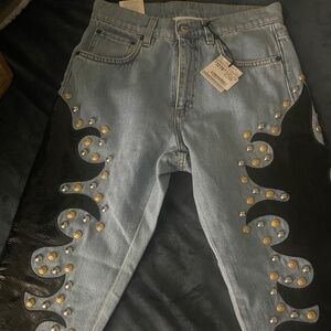 Moschino couture jeans with leather flame detail